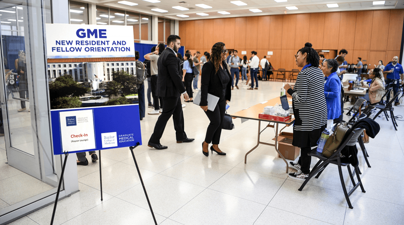 New trainees filter through tables at an orientation event